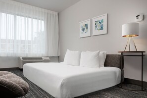 Premium bedding, down comforters, pillowtop beds, in-room safe