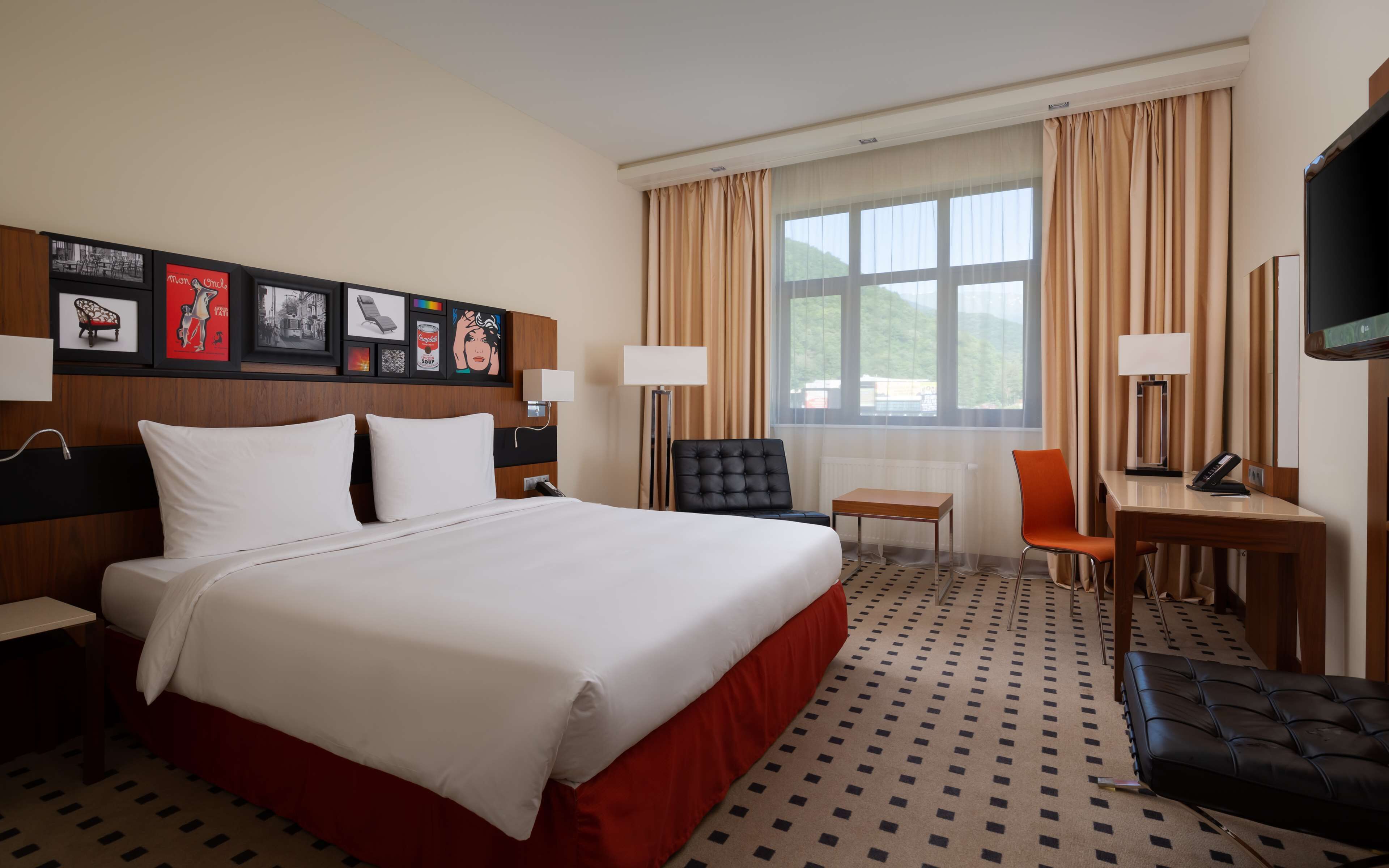 Superior Room, River View | Free minibar items, in-room safe, desk, iron/ironing board