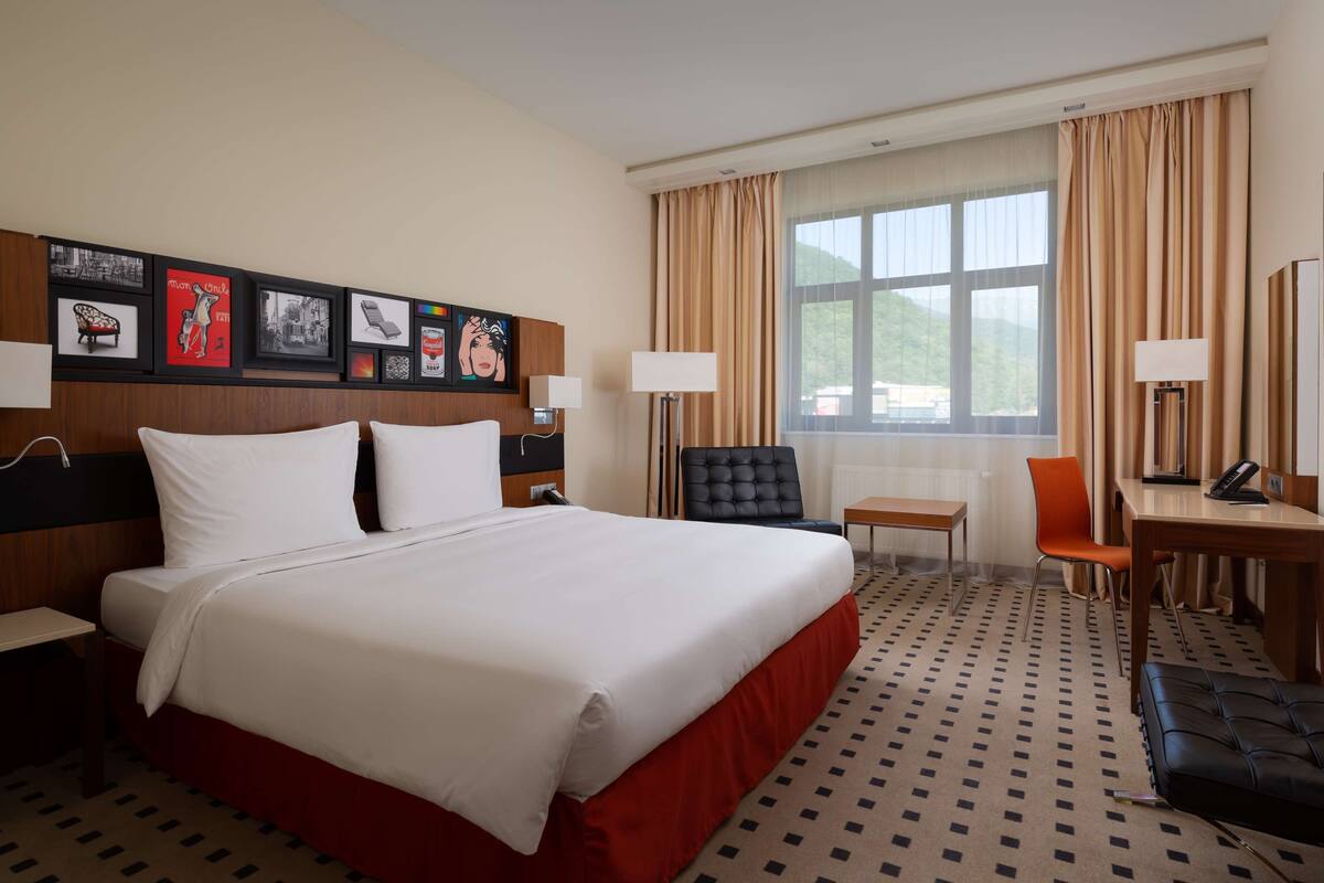Superior Room, River View | Free minibar items, in-room safe, desk, iron/ironing board