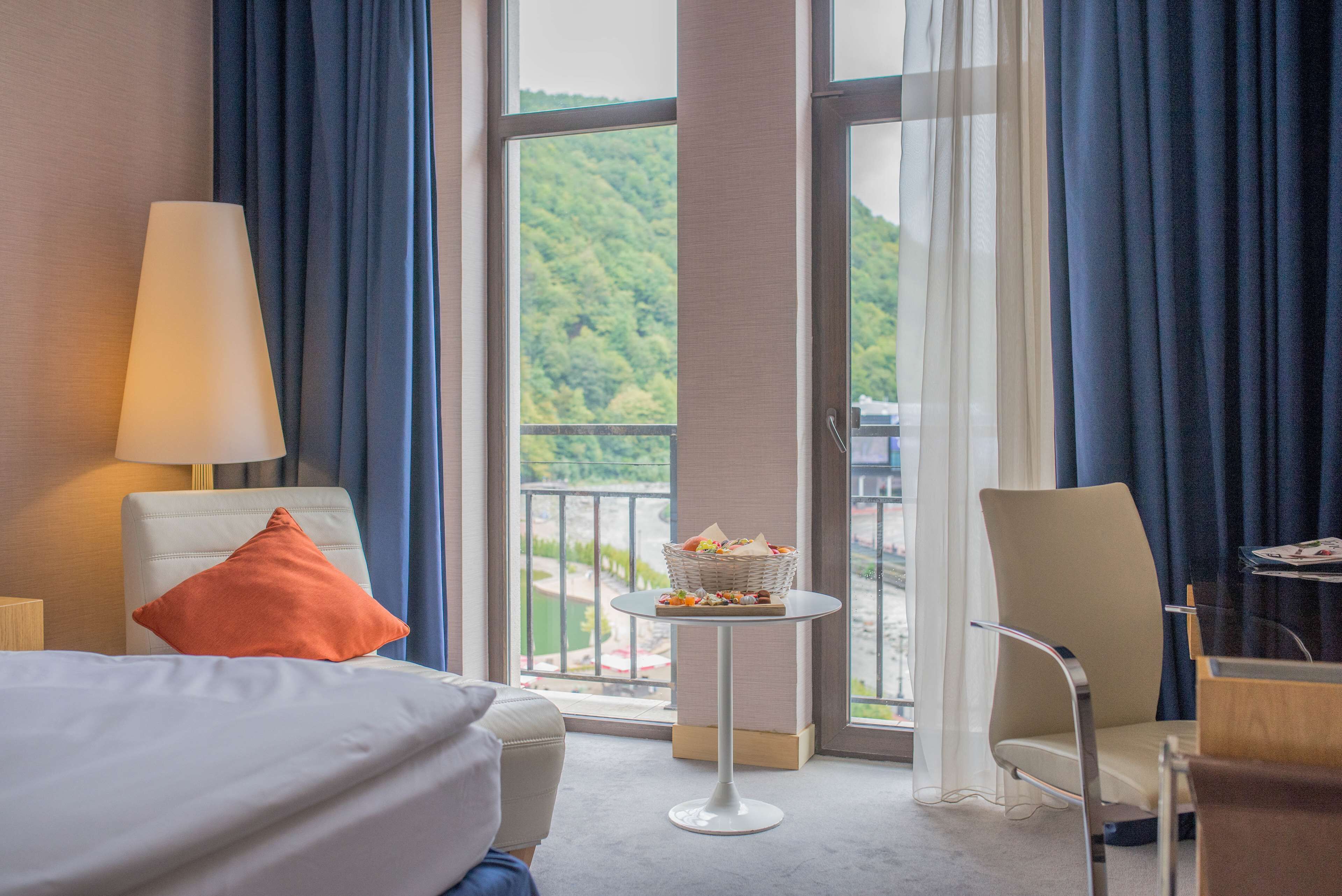 Premium Room, Balcony, River View | Free minibar items, in-room safe, desk, iron/ironing board