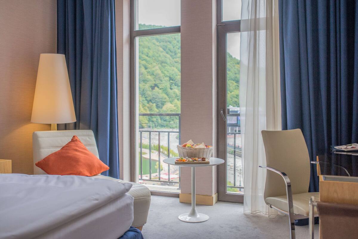 Premium Room, Balcony, River View | Free minibar items, in-room safe, desk, iron/ironing board