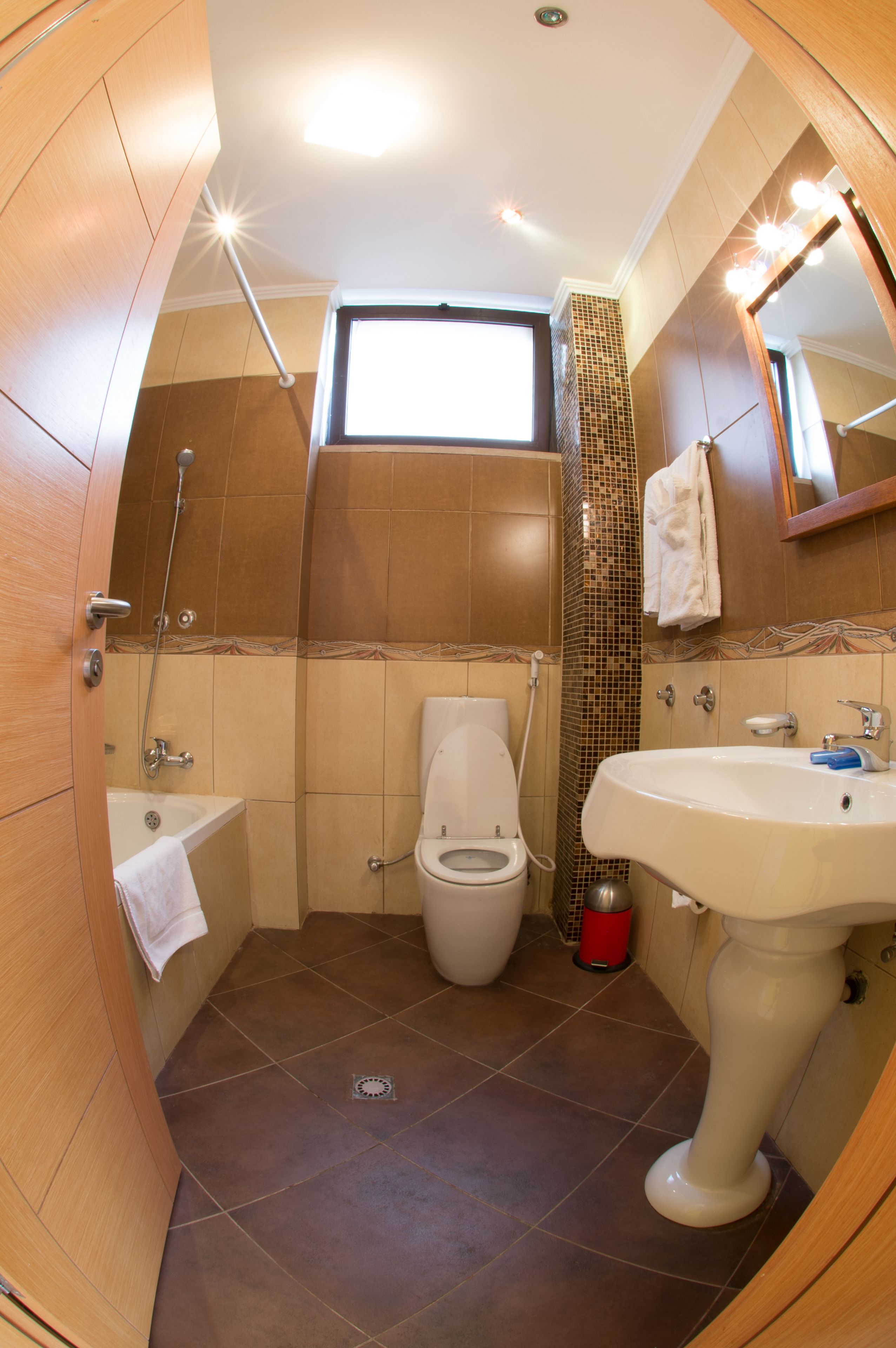 rainfall showerhead, hair dryer, slippers, towels