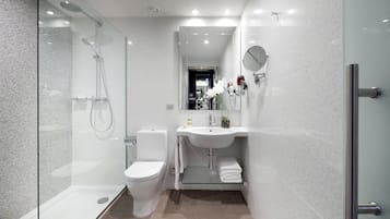 Designer toiletries, hair dryer, towels