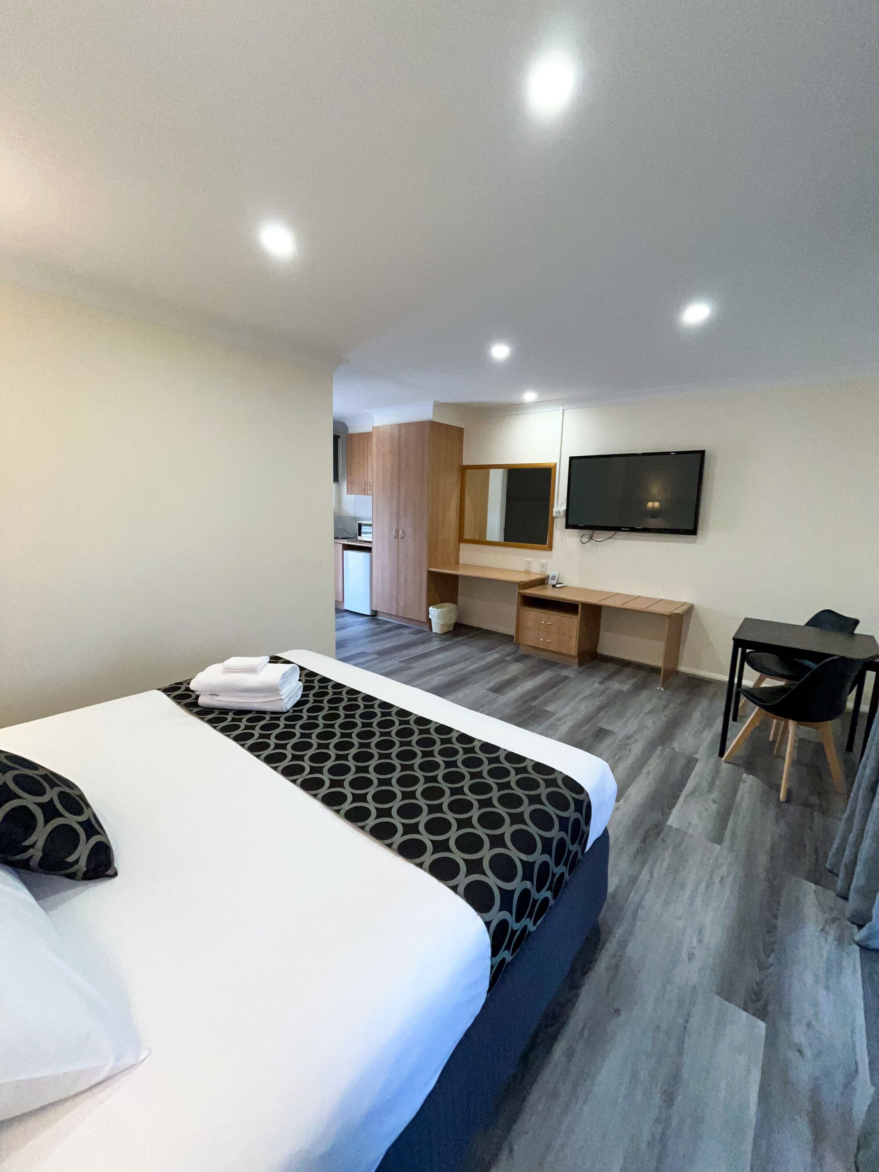 Premium bedding, laptop workspace, blackout drapes, iron/ironing board