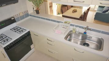 Ocean view Suite with kitchen | Private kitchen | Fridge, coffee/tea maker, electric kettle