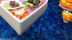 A floating platform with food and flowers on a pool. - De'bharata Bali Villas Seminyak (Seminyak)