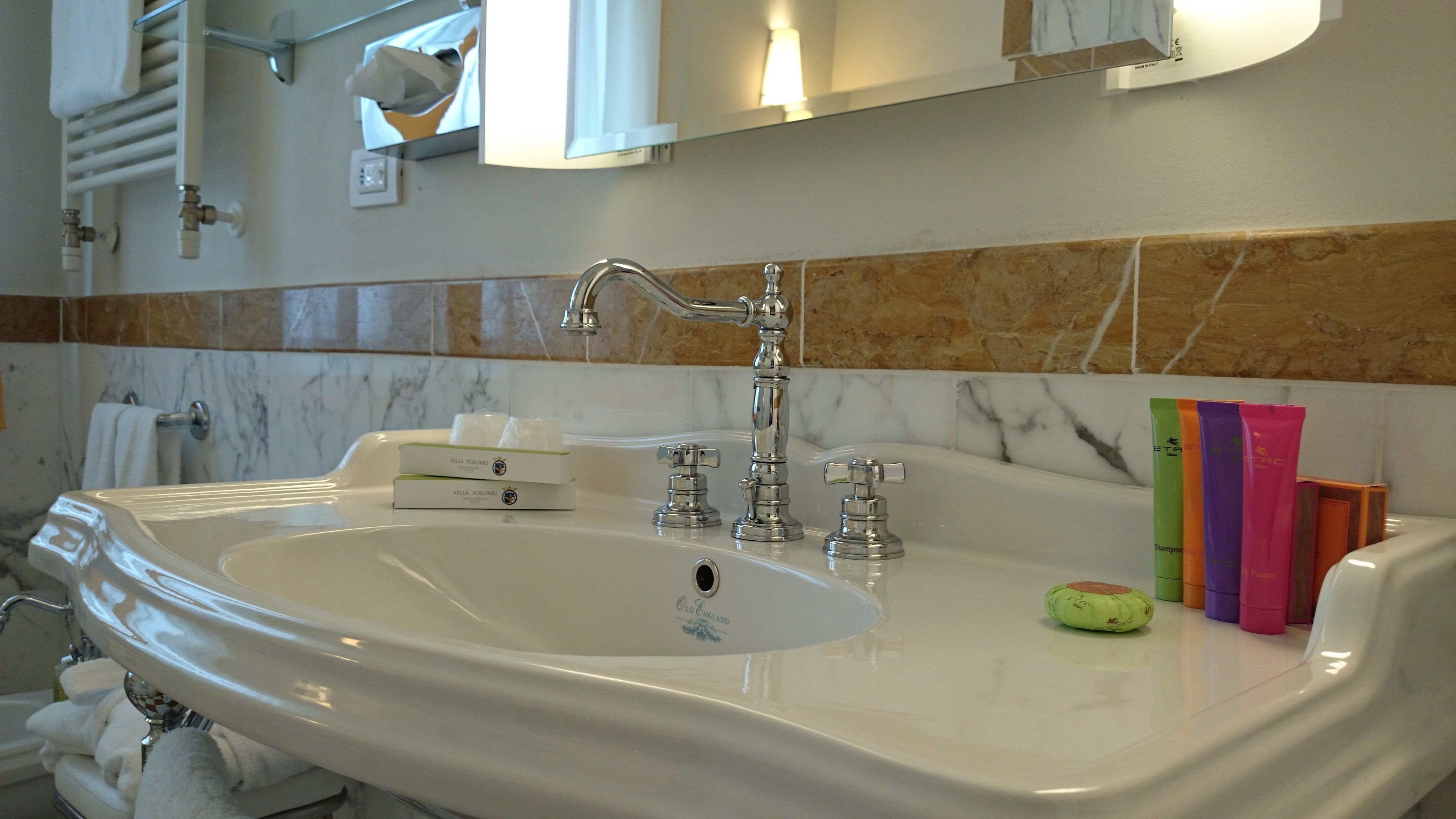 combined shower/bathtub, deep-soaking bathtub, designer toiletries