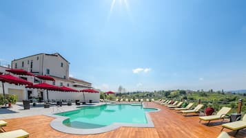 Seasonal outdoor pool, open 11:00 AM to 7:00 PM, pool umbrellas