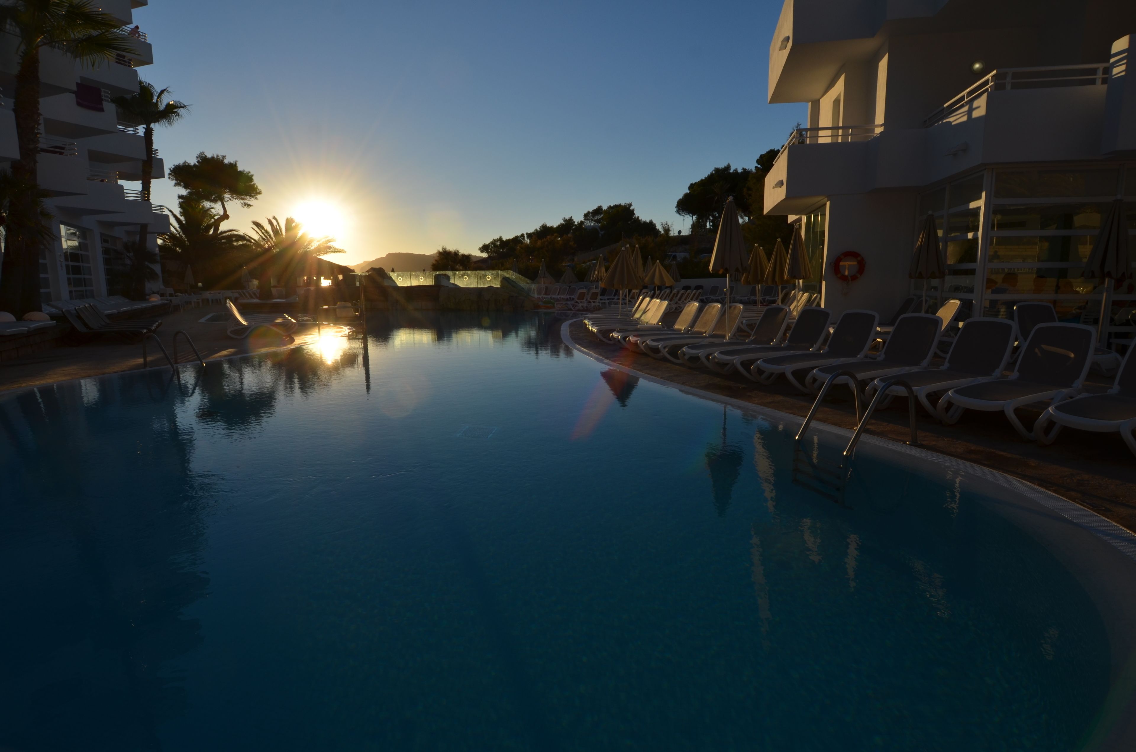 indoor pool, outdoor pool, pool umbrellas, pool loungers