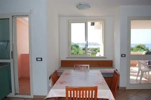 Standard Apartment, 1 Bedroom, Sea View (4 persone) | Living room | Flat-screen TV - Residence la Chimera (Villasimius)