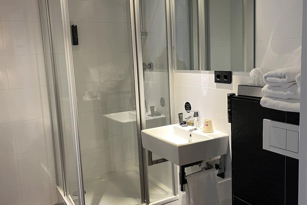 executive double room | bathroom | shower, free toiletries, hair dryer, towels