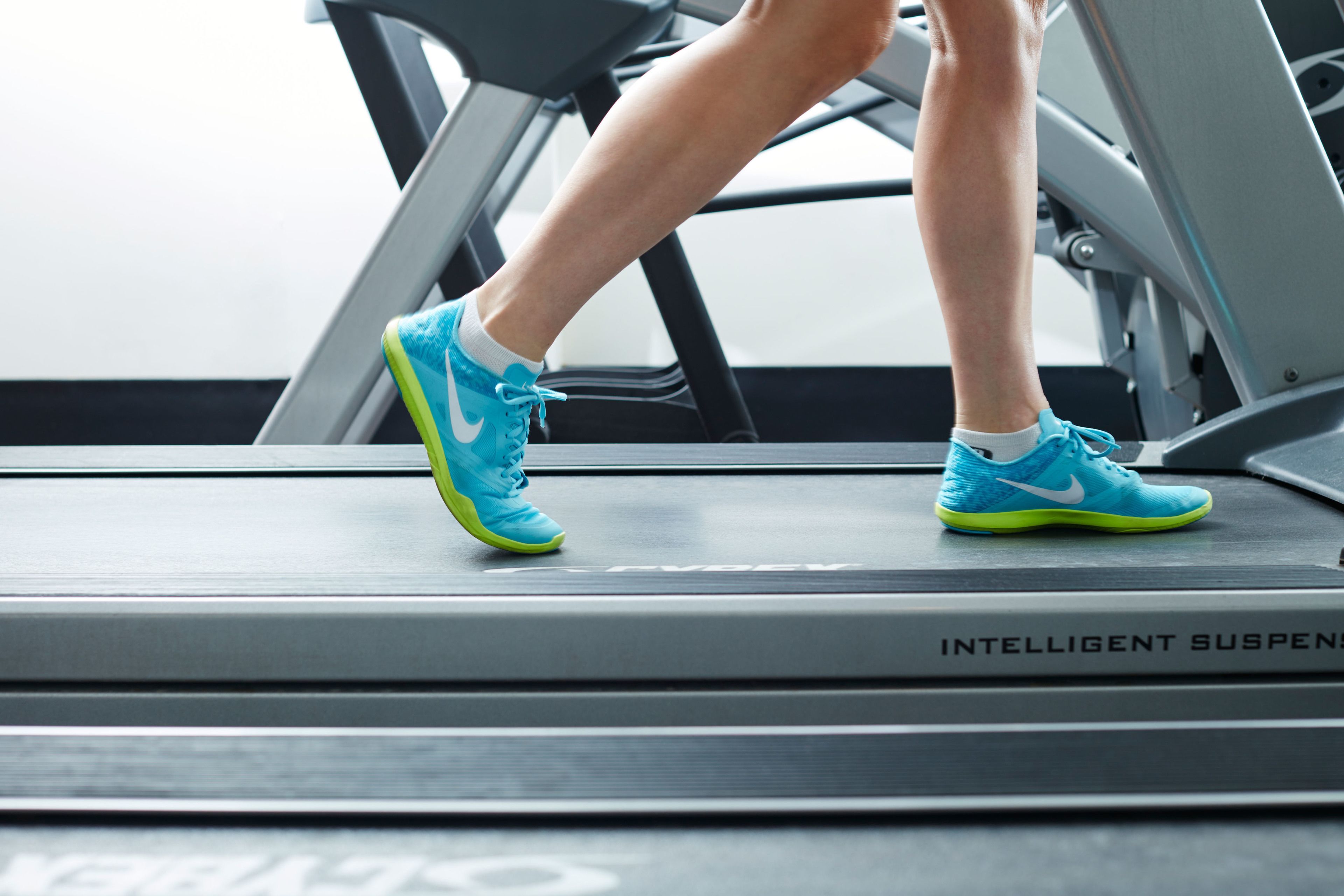 A treadmill with the text "INTELLIGENT SUSPENSION" visible on the side.