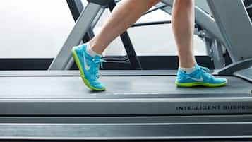 A treadmill with the text "INTELLIGENT SUSPENSION" visible on the side.