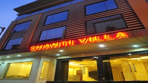 A modern hotel with a prominent 'SHANTHI VILLA' sign. - Shanti Villa (New Delhi)