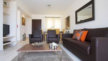 Condo, 2 Bedrooms | Living room | Flat-screen TV, DVD player