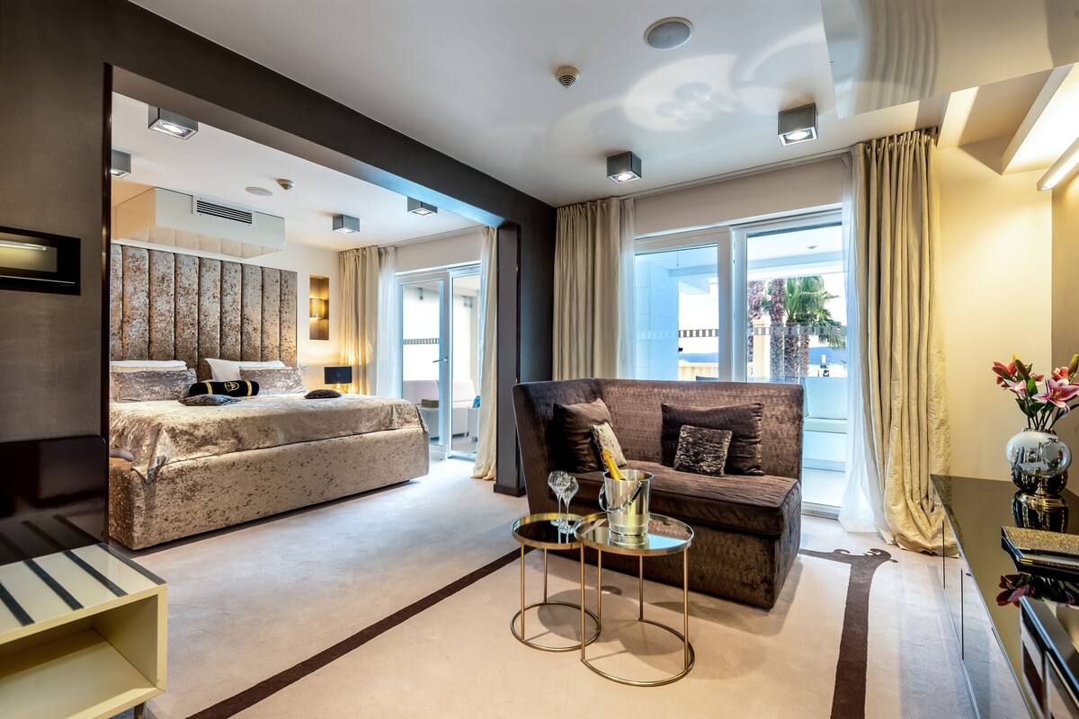 luxury suite, 1 king bed, sauna, sea view | premium bedding, minibar, in-room safe, individually decorated