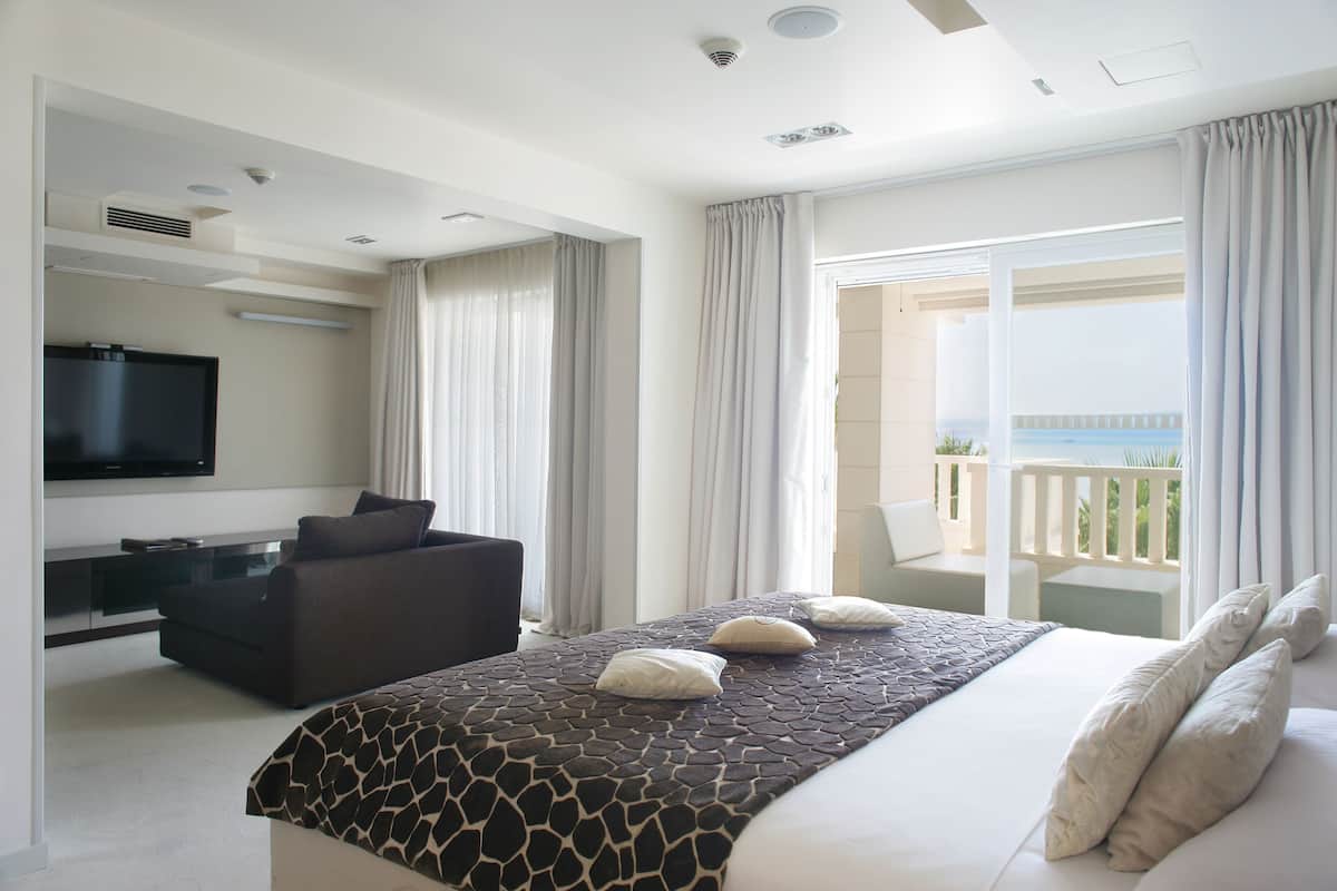 Deluxe Suite, Terrace, Sea View | Premium bedding, minibar, in-room safe, individually decorated