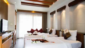 Family Room | Minibar, in-room safe, free WiFi, bed sheets