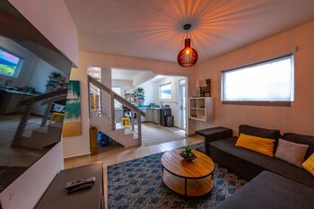 Standard House | Living area | TV at Casa Verde Hotel - Steps to the Beach | Pool, Restaurant & Bar