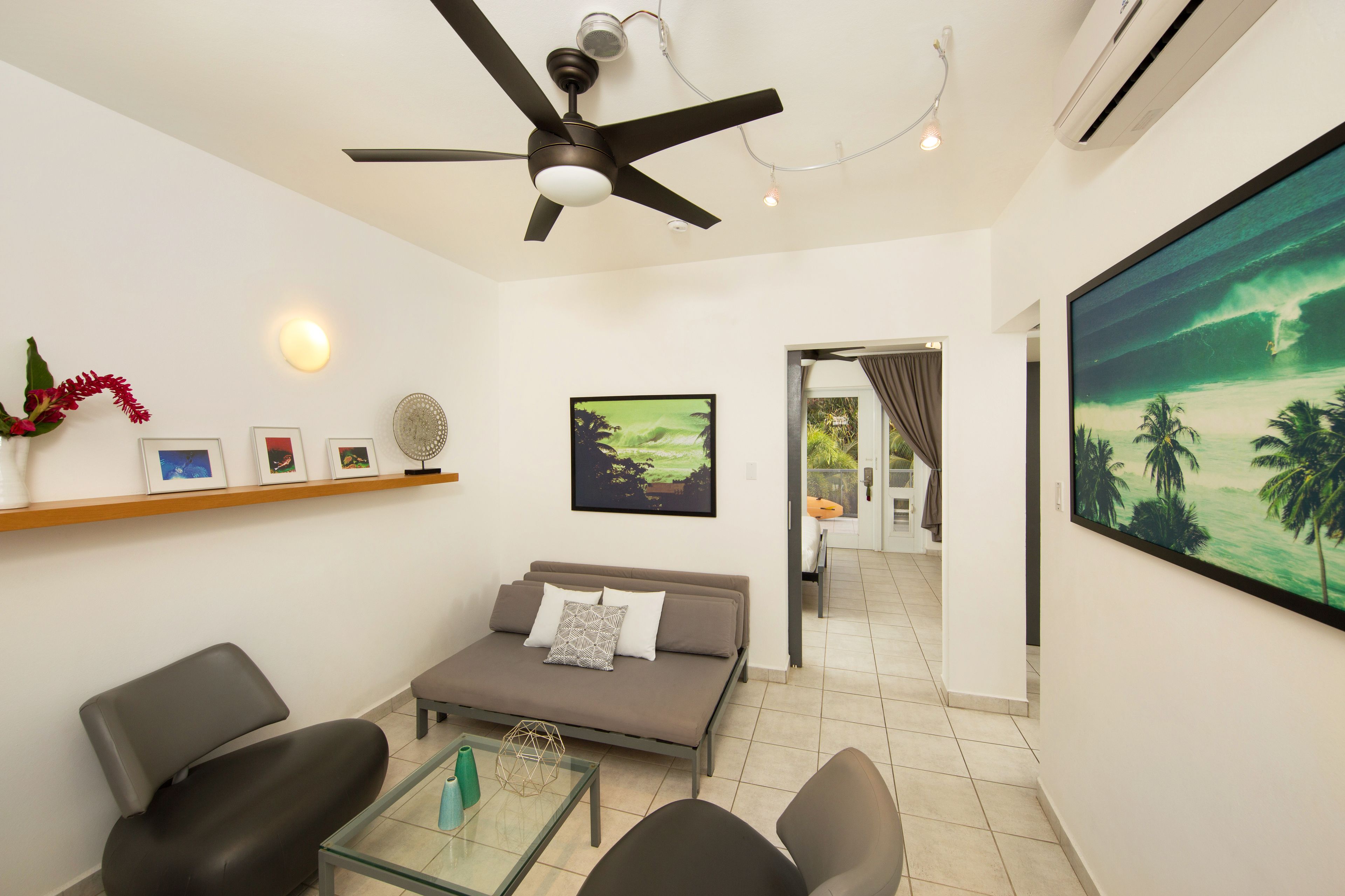 panoramic penthouse, 1 king bed, ocean view | living area | tv