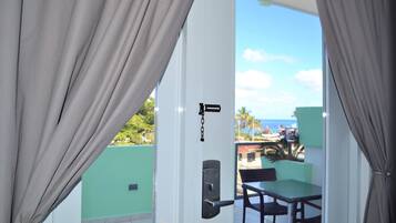 Panoramic Penthouse, 1 King Bed, Ocean View | 1 bedroom, in-room safe, individually decorated, individually furnished