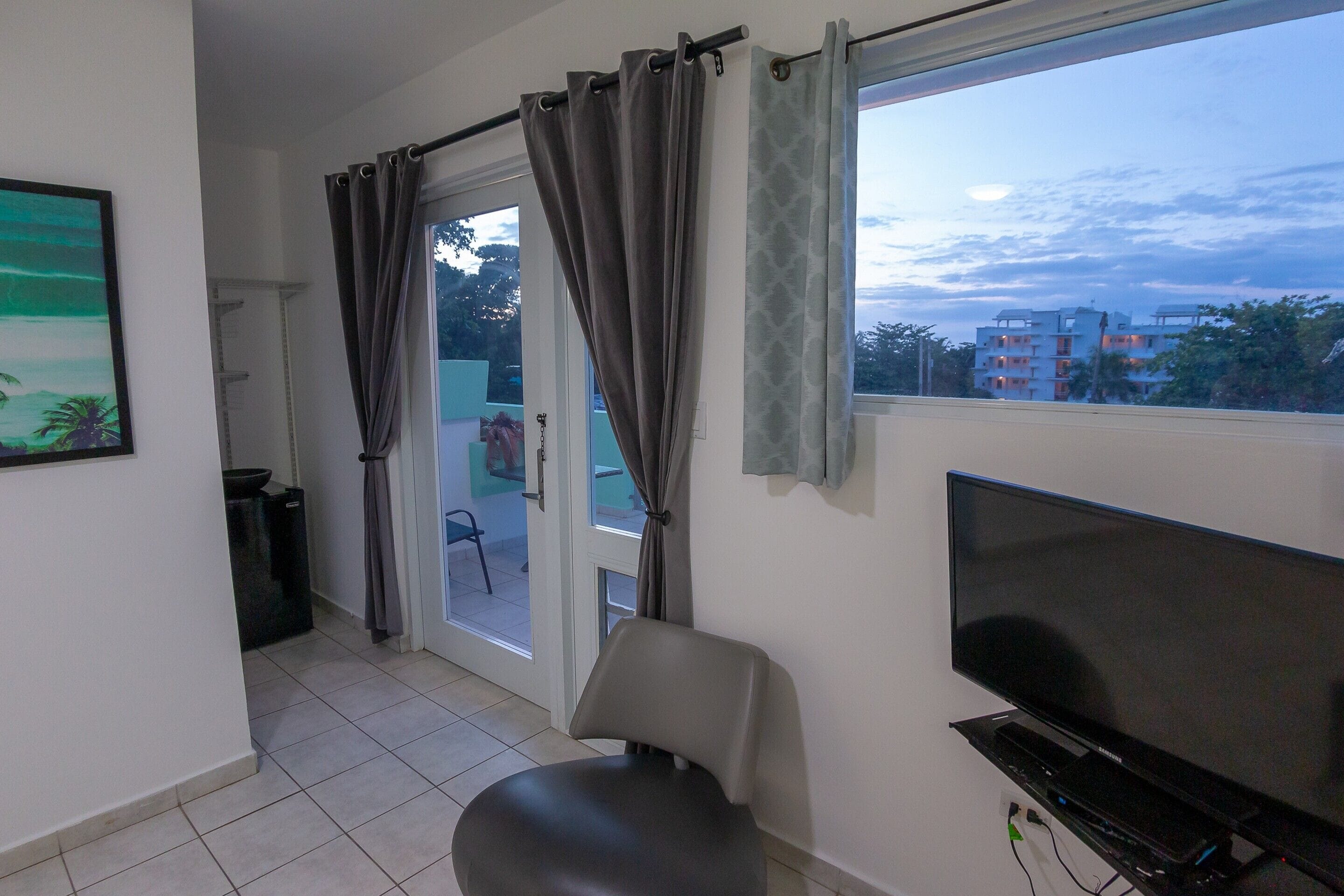 panoramic penthouse | living area | tv