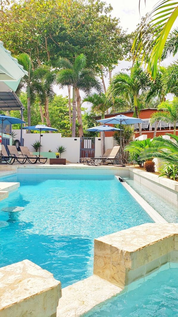Outdoor pool, pool umbrellas, pool loungers