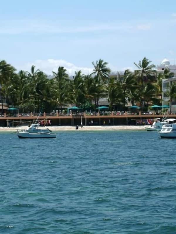 On the beach, white sand, beach towels, scuba diving