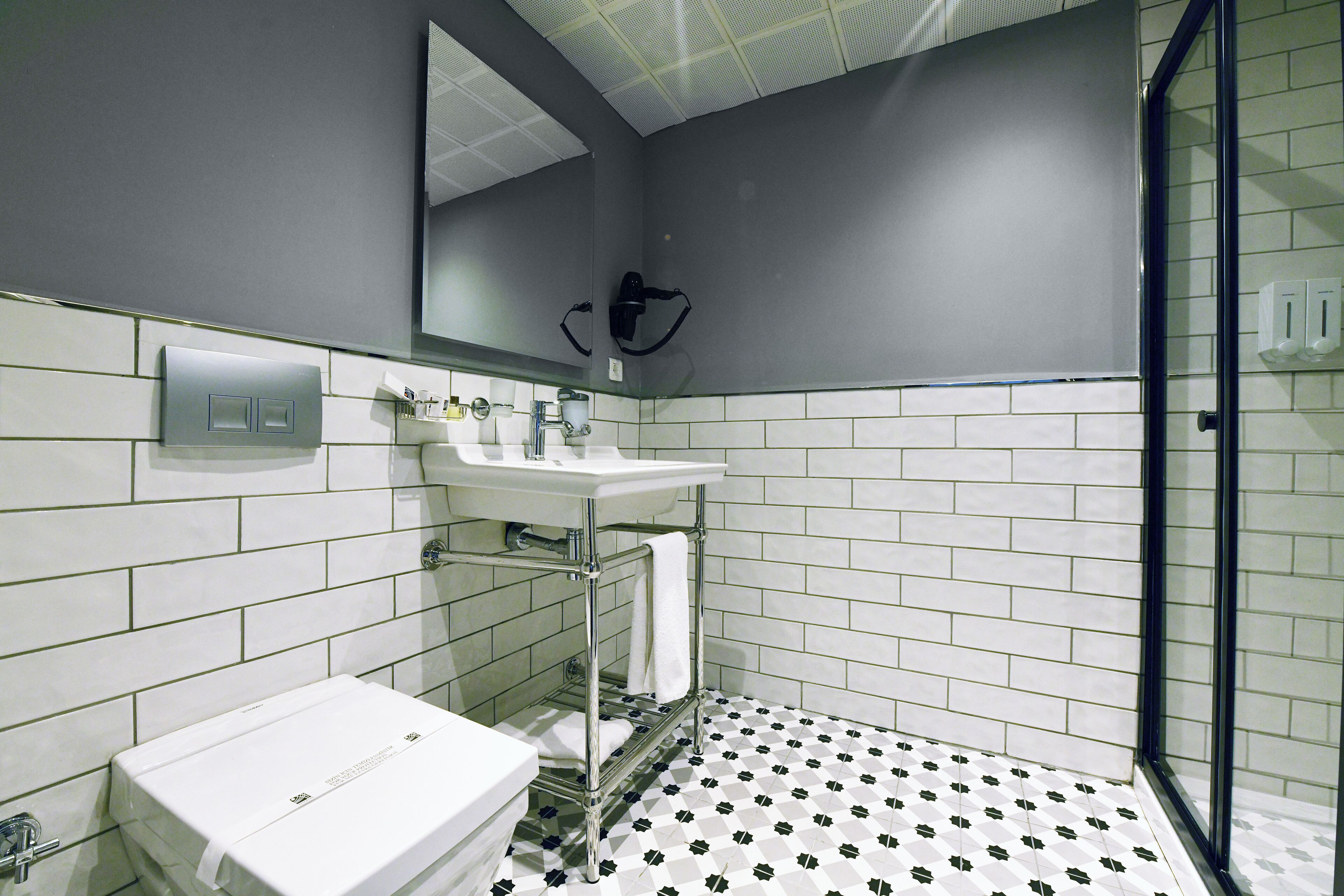 double room | bathroom | shower, rainfall showerhead, designer toiletries, hair dryer