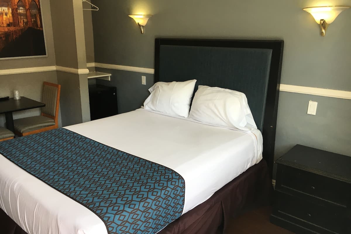 deluxe room, 2 queen beds | desk, iron/ironing board, free wifi