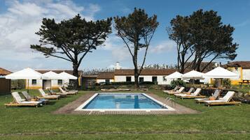 Seasonal outdoor pool, pool loungers