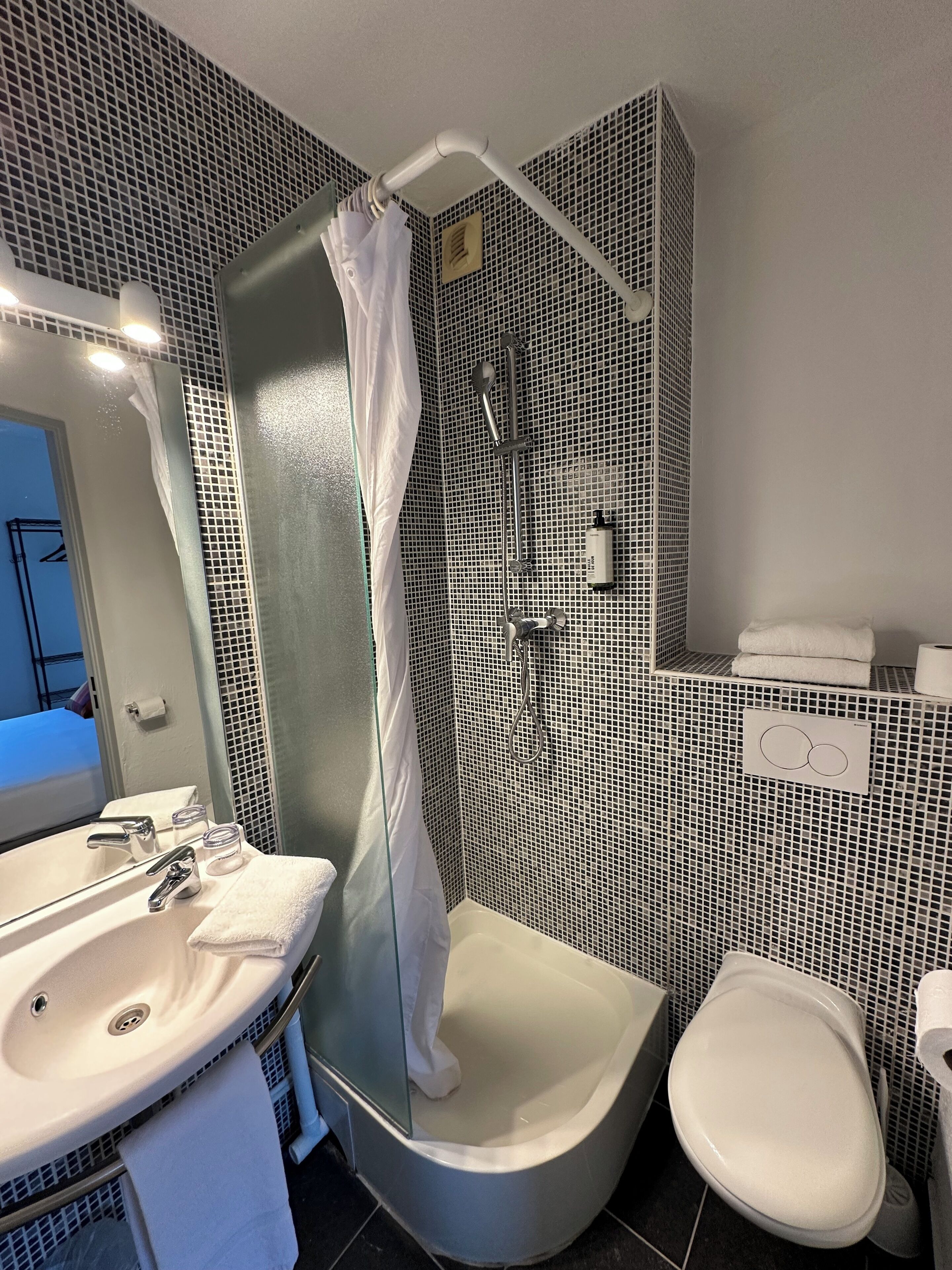 Renovated Double Room | Bathroom | Shower, hair dryer, towels