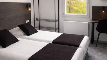 Renovated Twin Room | Desk, blackout drapes, iron/ironing board, free WiFi