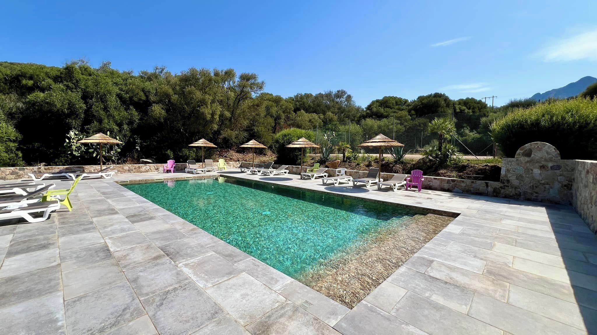 Seasonal outdoor pool, pool umbrellas, pool loungers