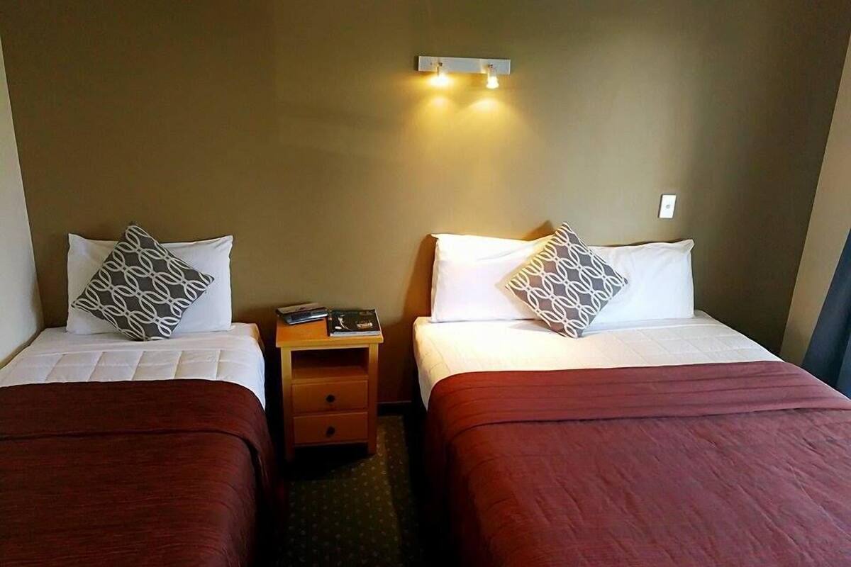 Twin Studio | Select Comfort beds, desk, blackout drapes, iron/ironing board