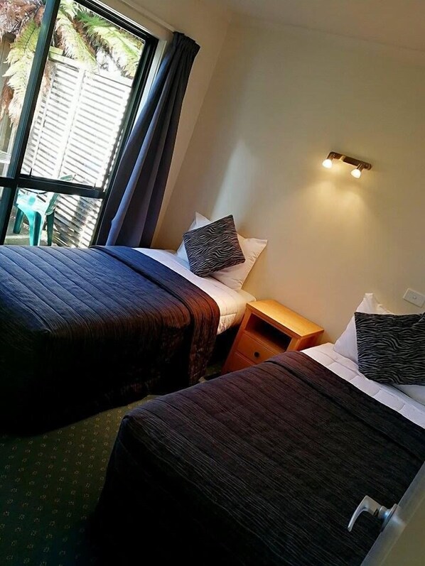 Queen Suite with Spa Bath | Select Comfort beds, desk, blackout drapes, iron/ironing board