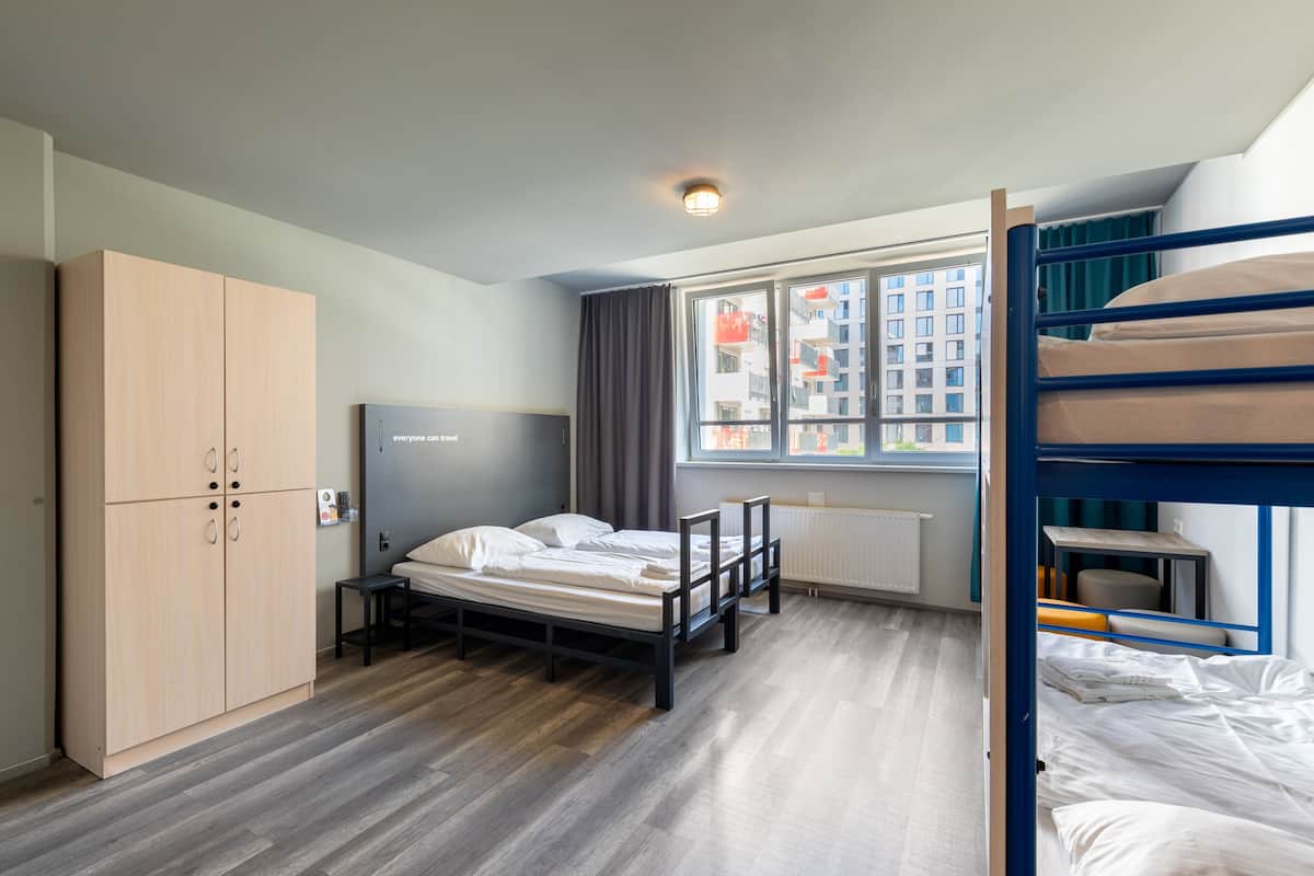 Enjoy a functional room with a single bed, wardrobe, and city view.