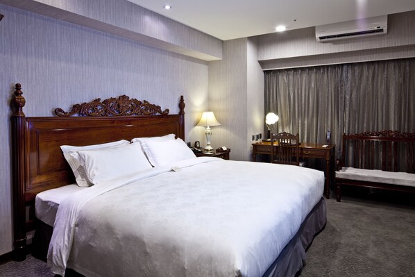 Hypo-allergenic bedding, down duvets, in-room safe