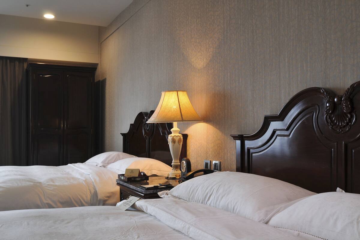 Deluxe Family Room | Hypo-allergenic bedding, down duvets, in-room safe, desk