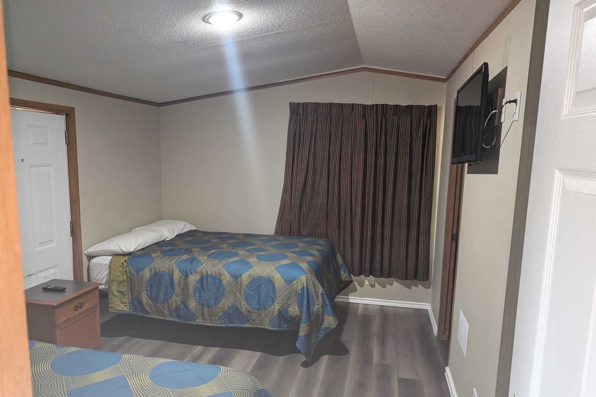 Premium bedding, memory foam beds, desk, laptop workspace