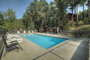 Seasonal outdoor pool, open 9:00 AM to 10:00 PM, pool loungers