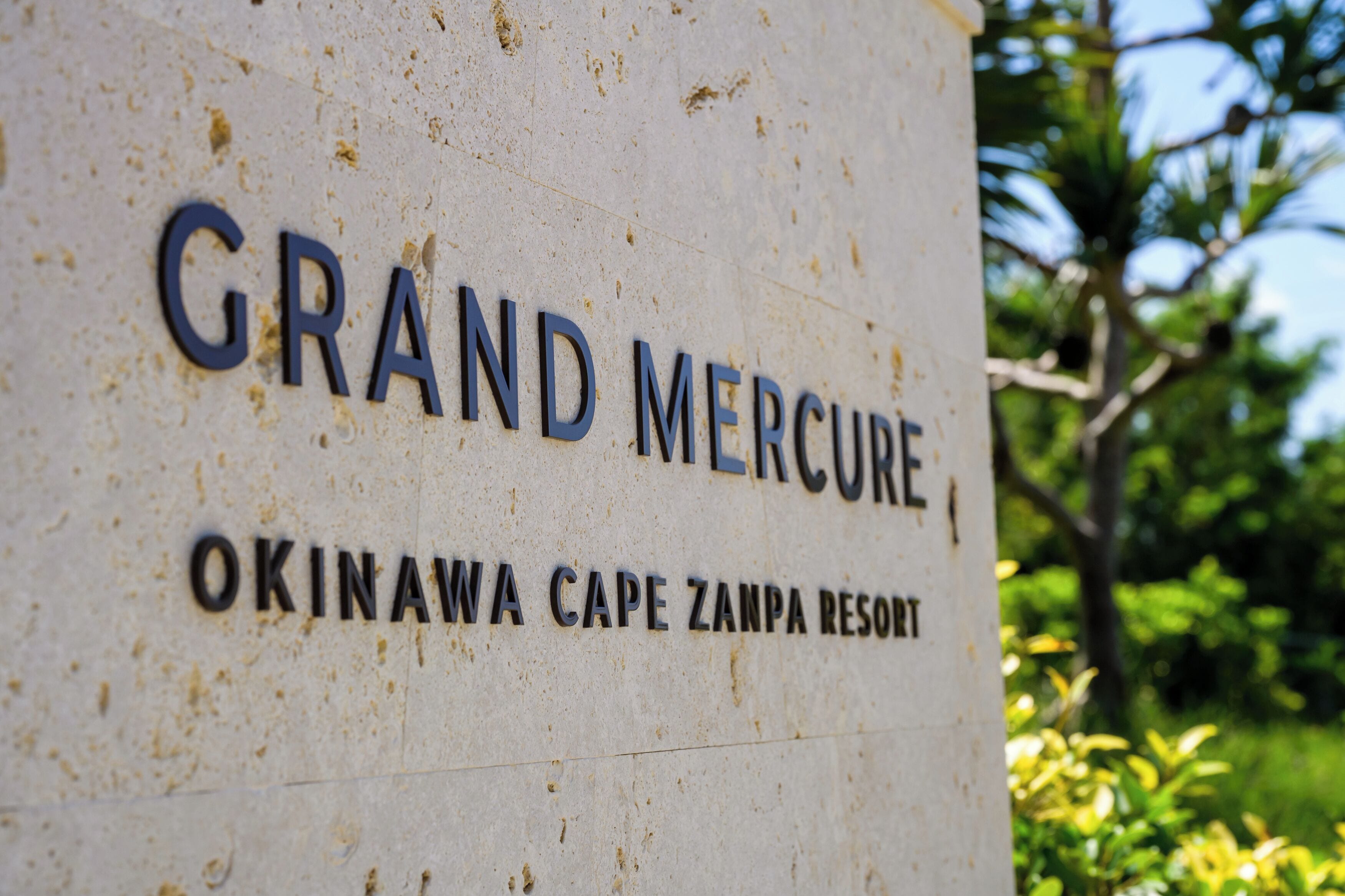 A sign for Grand Mercury Okinawa Cape Zampa Resort.