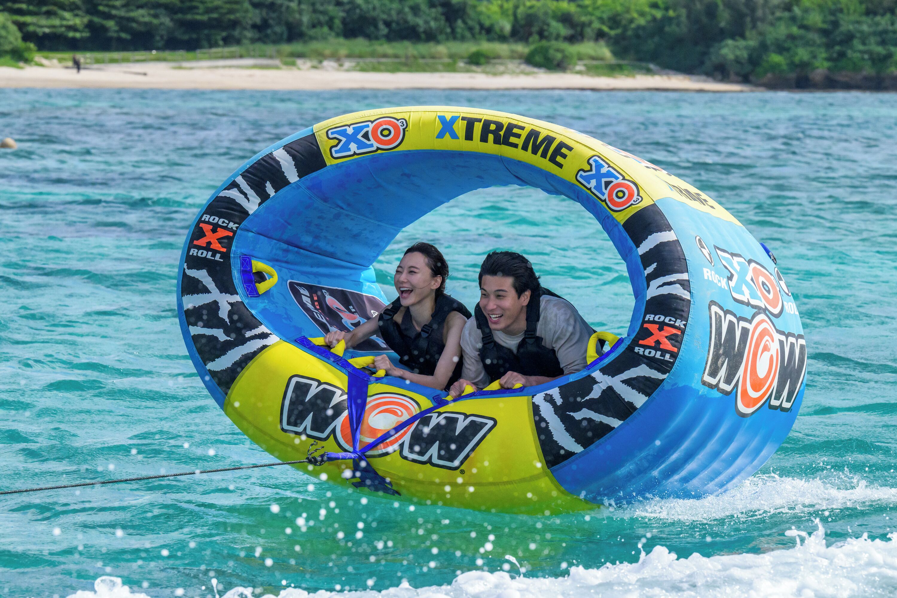 A water tube with "Xtreme" branding floating on a body of water.