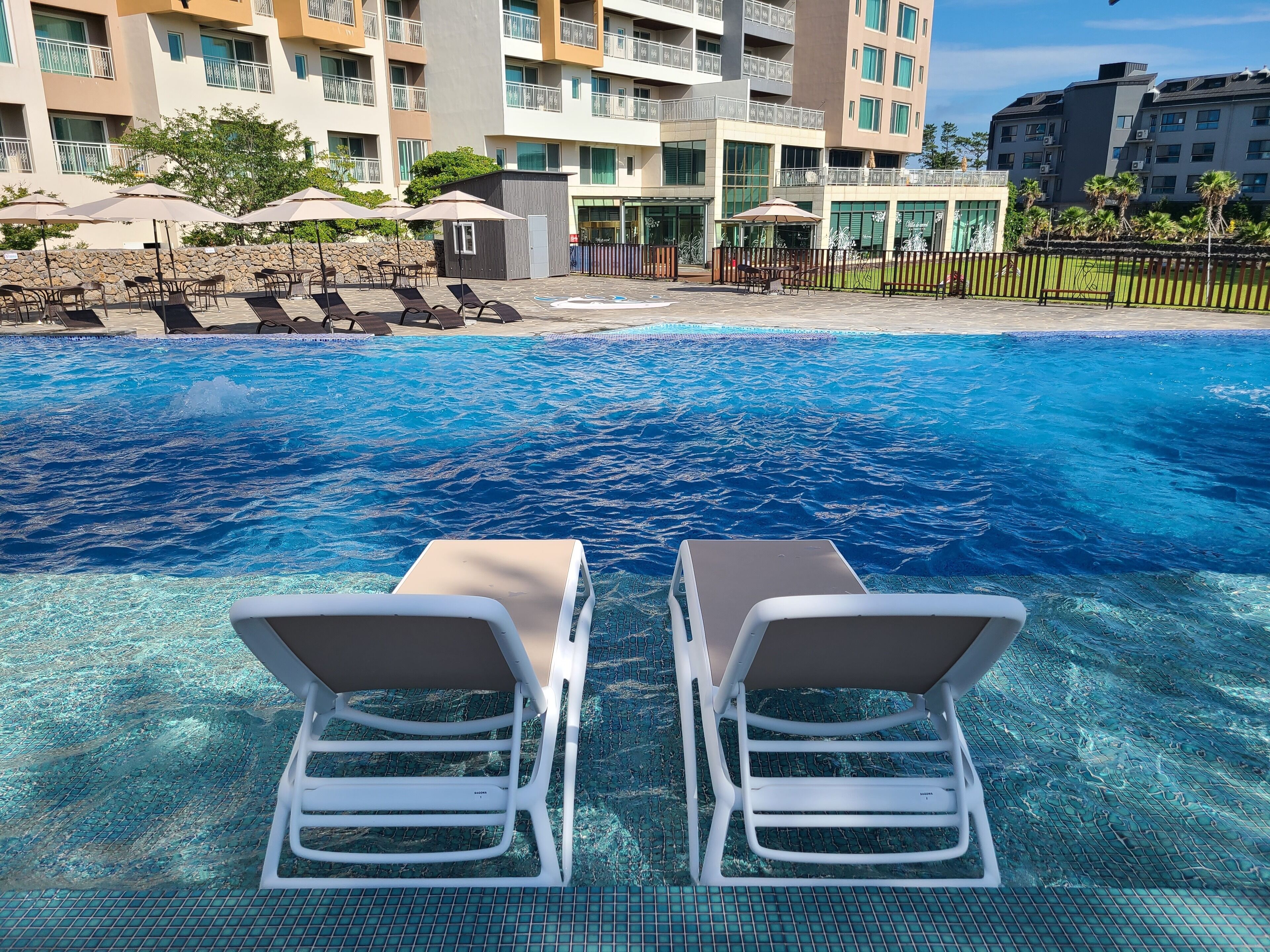 seasonal outdoor pool, open 9:00 am to 9:00 pm, pool loungers