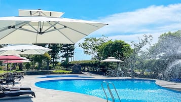 Seasonal outdoor pool, open 11:00 AM to 7:00 PM, pool umbrellas