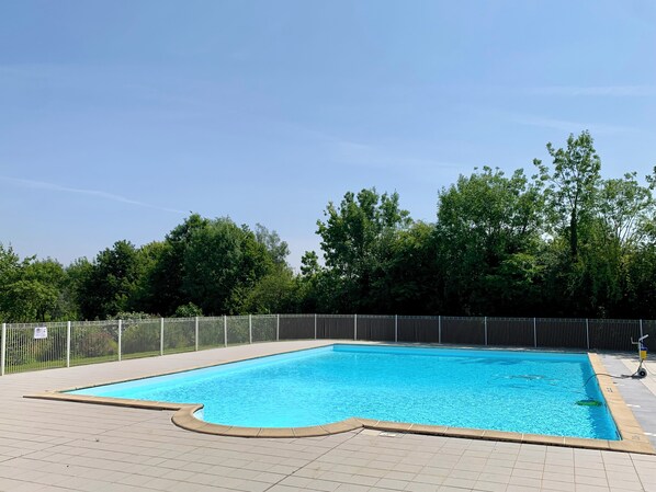 Seasonal outdoor pool, pool loungers