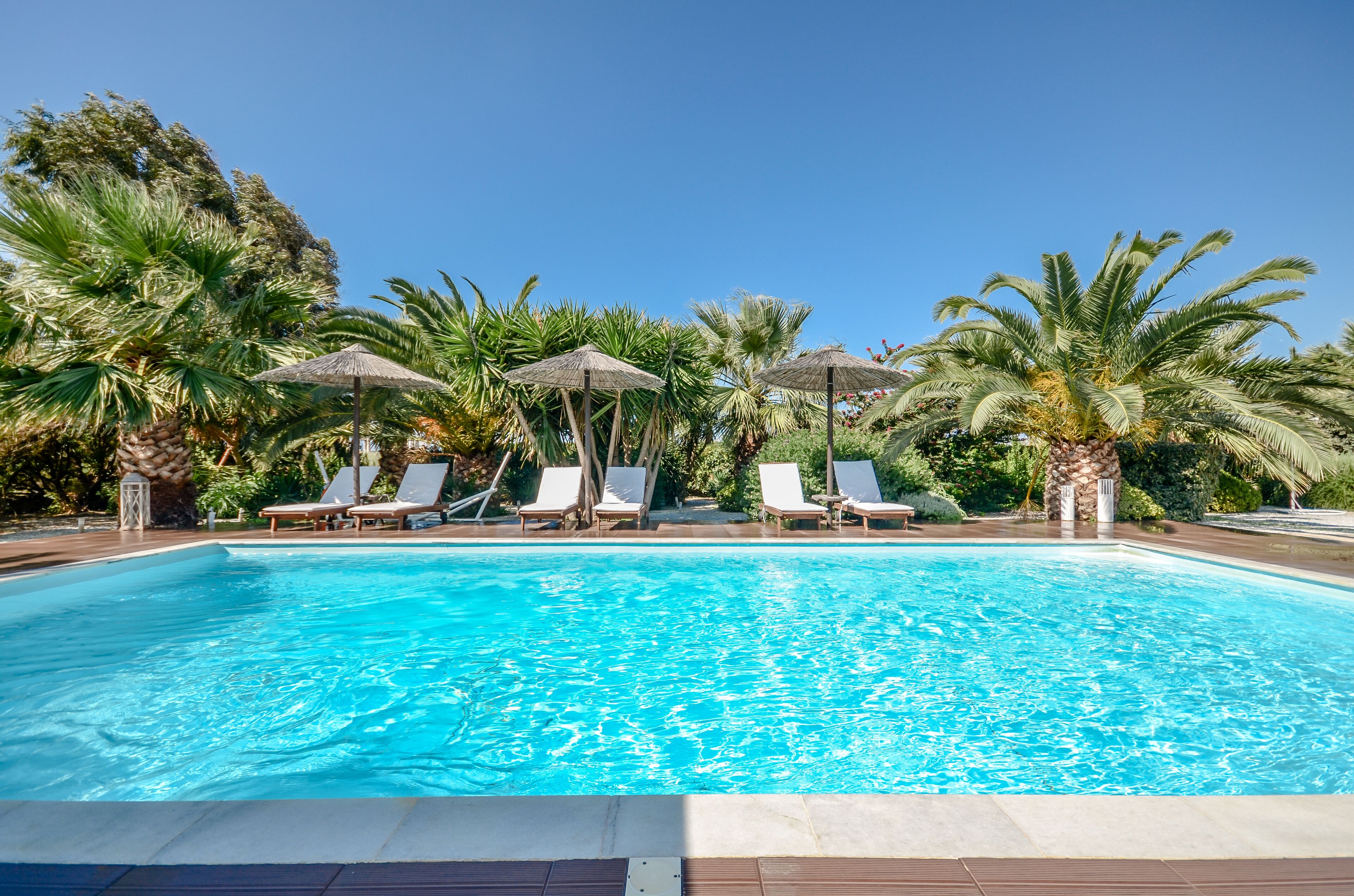 Seasonal outdoor pool, open 8:30 AM to 8:00 PM, pool umbrellas