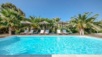 Seasonal outdoor pool, open 8:30 AM to 8:00 PM, pool umbrellas