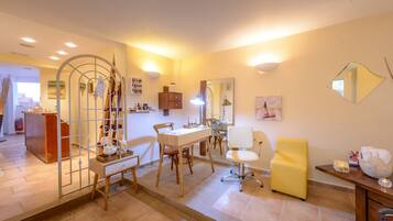 Cozy space with a dining table, desk, and mirror, perfect for working or relaxing.