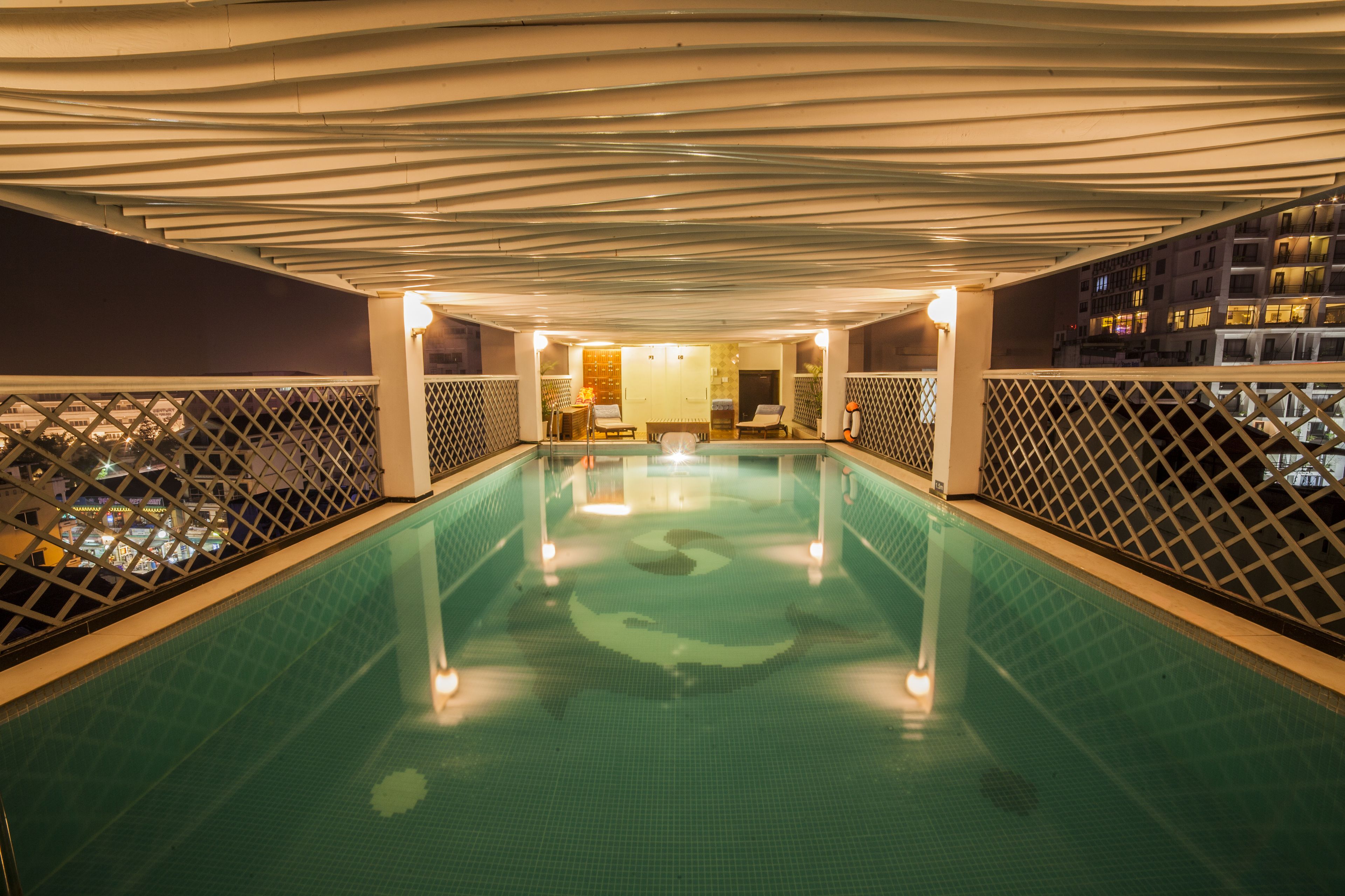 indoor pool, pool umbrellas, pool loungers